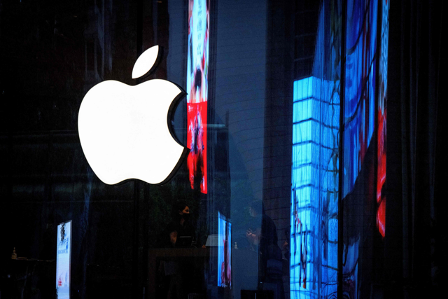 In this file photo taken on September 23, 2020 the Apple logo is seen on the window of the newly opened company store in Bangkok  (AFP photo)