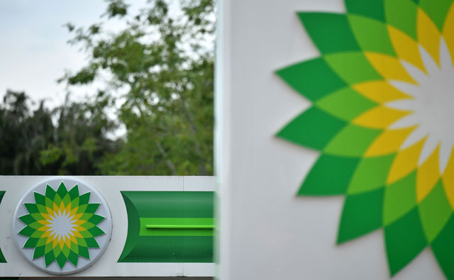 BP logos are seen at a BP petrol station in Hildenborough, southeast of London, on June 15  (AFP photo)