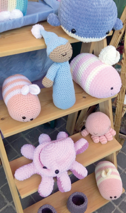 Crochet products by a refugee are on display at a public bazaar in Amman on Monday (Photo by Batool Ghaith)