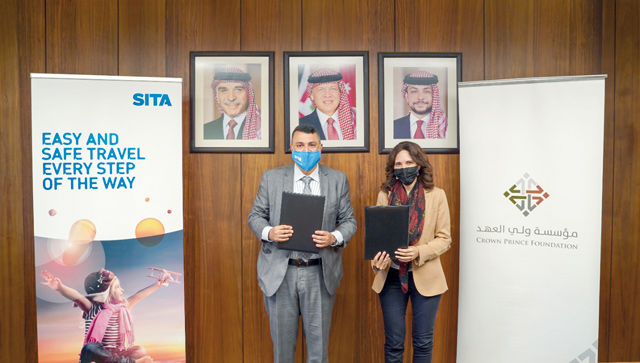 CPF CEO Tamam Mango and Hani El Assaad, president of the Middle East, India and Africa Department at SITA, pose for a photo during the signing ceremony of a memorandum of understanding on Wednesday (Petra photo)