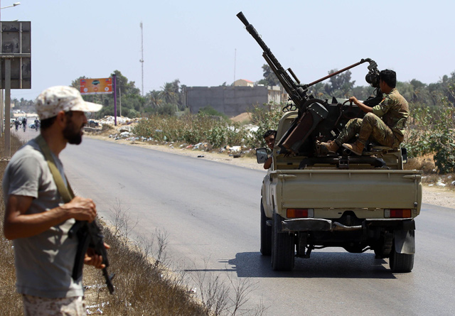 Libyan security forces patrol on Thursday near the site of an attack on a checkpoint in the city of Zliten. The attack between the Libyan capital and the town of Zliten killed four soldiers of the UN-backed unity government, the town's mayor said (AFP photo)