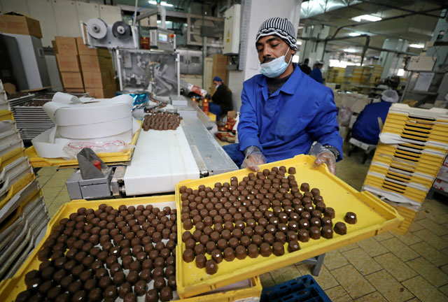 An Egyptian worker at a local chocolate factory in Cairo, Egypt, on February 5 (Reuters photo)
