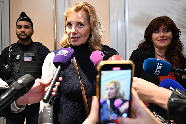 French film set designer and the plaintiff Amelie (centre), speaks to the media after leaving the court room of the trial of French actor Gerard Depardieu, accused on sexual assault, at the Paris court house in Paris on Monday (AFP photo)