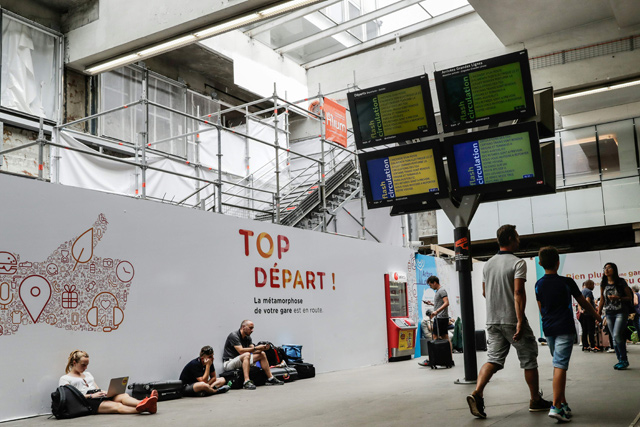 People wait at the railway station gare Montparnasse in Paris on Monday as rail operator SNCF warned services were not expected to return to normal until August 6 following a fire at a high-voltage substation outside Paris (AFP photo)