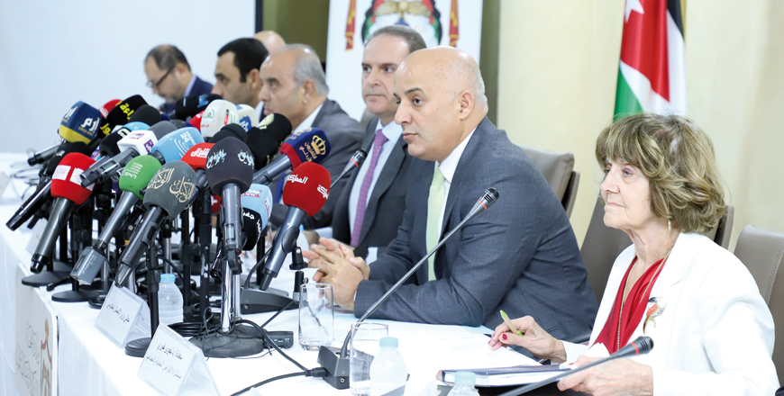 Health Minister Feras Hawari and officials during a press conference in Amman on Monday (Petra photo)