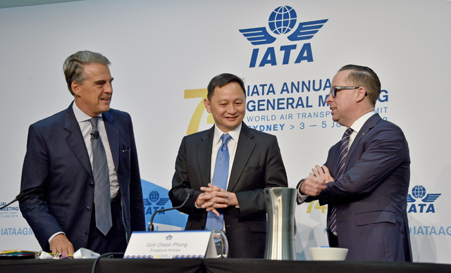 International Air Transport Association (IATA) Chief Executive Alexandre de Juniac (left), Singapore Airlines Chief Executive Goh Choon Phong (centre), and Qantas Chief Executive Alan Joyce talk before a press conference at the annual meeting of global airlines in Sydney on Monday (AFP photo)