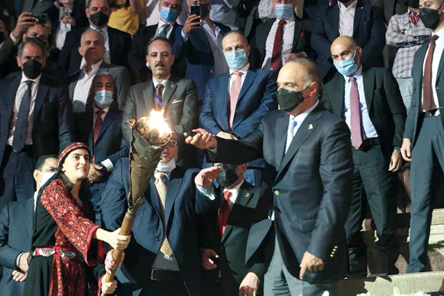Prime Minister Bisher Al Khasawneh lights the torch of the 35th Jerash Festival for Culture and Art in Jerash on Wednesday (Petra photo)