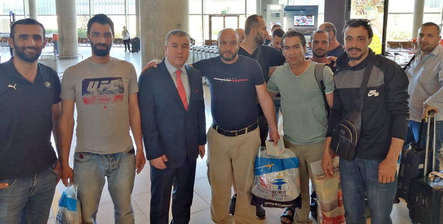 Jordanian engineers are received by Ahed Sweidat (third from left), the director of the consulate affairs department at the Foreign Ministry, as they return from Kazakhstan on Thursday  (Photo courtesy of Foreign Ministry)