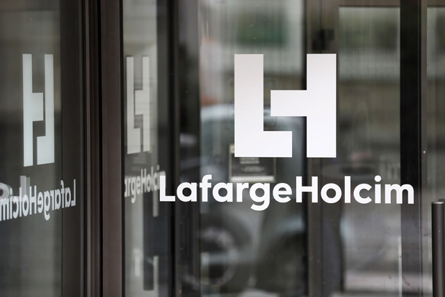 This photo taken on March 9 shows the company’s logo at an entrance of the French headquarters of LafargeHolcim, a group created in 2015 by the merger of French cement manufacturer Lafarge and its Swiss counterpart Holcim (AFP photo)