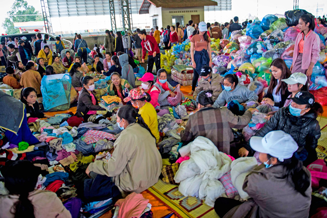 Displaced residents seek shelter in Paksong town, Champasak province, following massive floodings from the collapsed dam on Wednesday  (AFP photo)