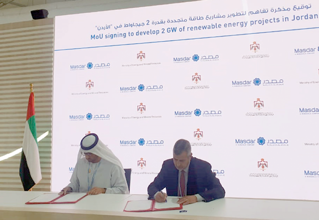 Energy Minister Saleh Kharabsheh and UAE Minister of Industry and Advanced Technology, Special Envoy for Climate, and Chairman of Masdar, Sultan Al Jaber sign an agreement on Wednesday (Photo courtesy of Energy Ministry)