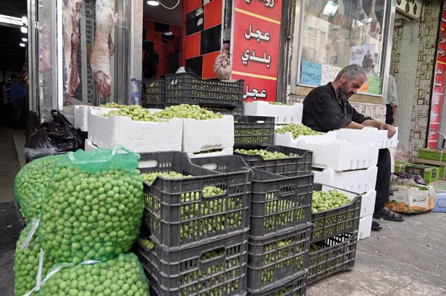 A man is seen selling freshly harvested olive seeds in Amman in this recent photo (Photo by Amjad Ghsoun)