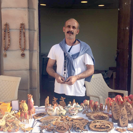 Eyad Saqer poses for a photo at his workshop (Photo courtesy of Eyad Saqer)