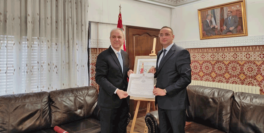 Chargé d'Affaires of the Moroccan embassy, Adel Oussi Hamou, presents the order to Jordan's ambassador to Morocco Hazem Al Khateeb   (Petra photo)