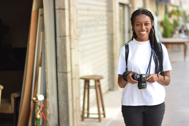 Semhal Tsegaye, selected as a mentee by Women Photograph, stops for a photo in Jabal Luweibdeh (Photo by Mina Mohit)