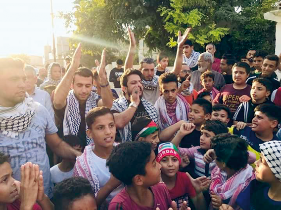 People are seen during a gathering in Amman in support of Palestinians in Amman on Sunday (Photo courtesy of Ahel El Balad Facebook page)