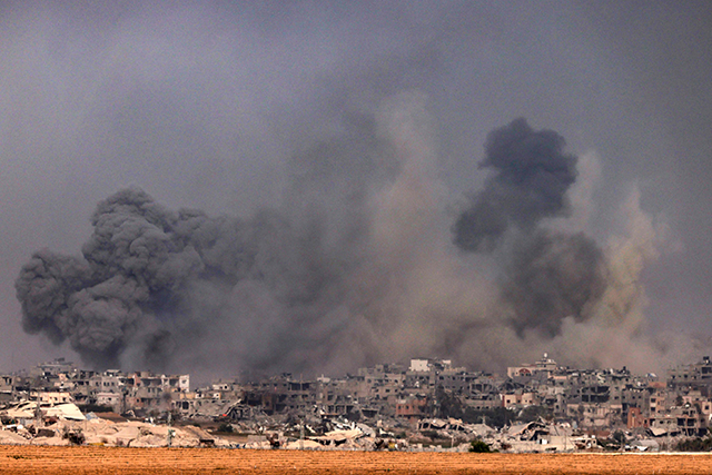 A photo taken from southern Israel near the border with the Gaza Strip on Sunday, shows smoke rising above the northern part of the Palestinian enclave (AFP photo)