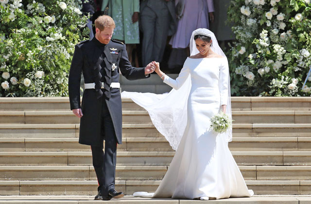 Britain’s Prince Harry, Duke of Sussex and his wife Meghan, Duchess of Sussex emerge from the West Door of St George’s Chapel, Windsor Castle, in Windsor, on Saturday after their wedding ceremony (AFP photo)