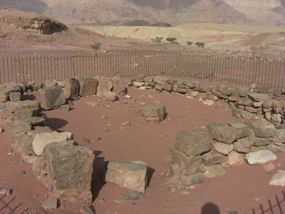   Consecutive open courtyard shrines at Timna Valley Site 2. View of the earlier shrine from the southeast, with altar at the centre, and basin and row of standing stones in the back left corner (Photo courtesy of Juan Tabes)