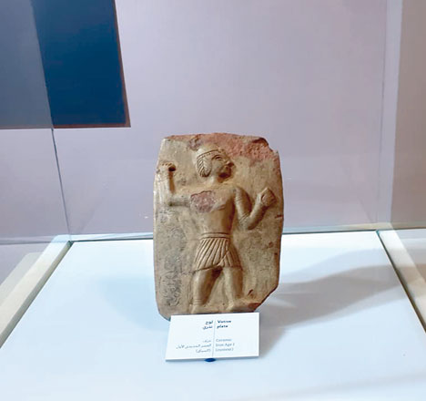 A ceramic plate dating to the Early Iron Age depicts a man in a battling position  (Photo by Saeb Rawashdeh)