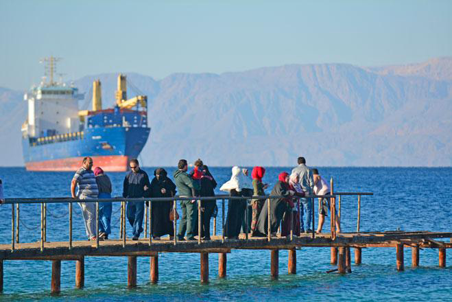 Visitors enjoy the view of the Gulf of Aqaba from a jetty in the port city, some 330 kilometres south of the capital, in this file photo (JT file photo)