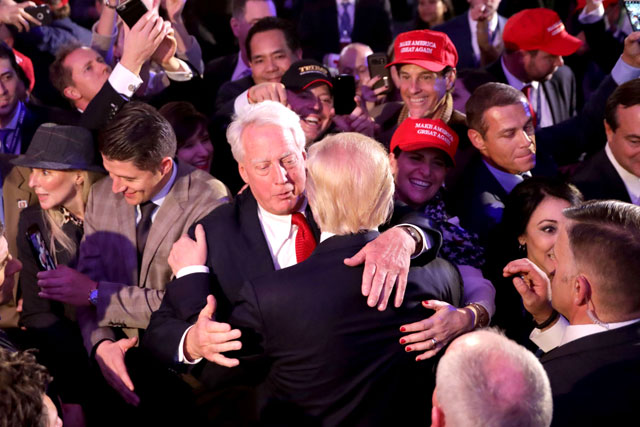 In this photo, taken on November 9, 2016, Republican president-elect Donald Trump (front) hugs his brother Robert Trump after delivering his acceptance speech in New York City (AFP file photo)