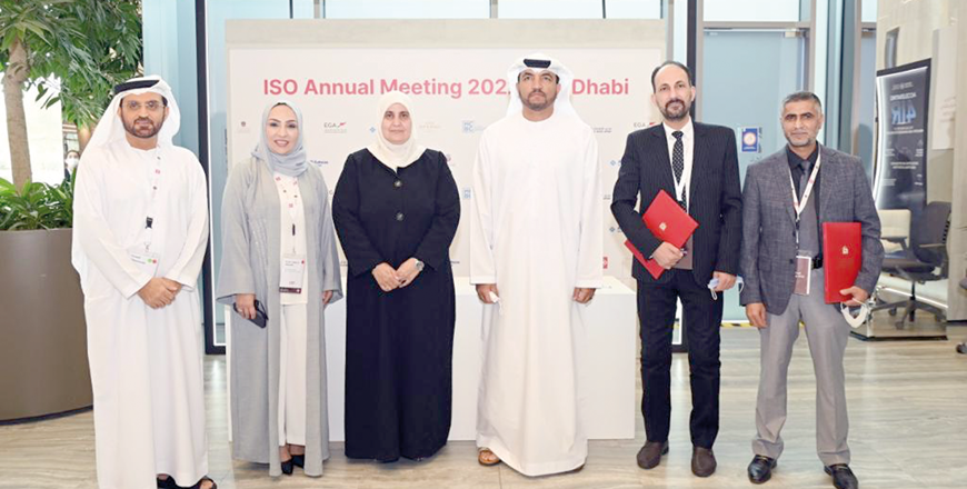 Omar Al Suwaidi, undersecretary of the Ministry of Industry and Advanced Technology, and Abeer Barakat Al Zuhair, director general of the JSMO, and guests pose for a photo during a signing ceremony (Photo courtesy of the UAE’s Ministry of Industry)