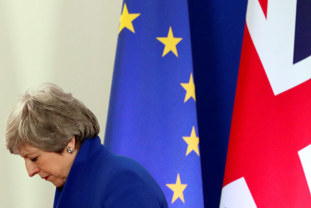 British Prime Minister Theresa May leaves after a news conference following an extraordinary European Union leaders summit to discuss Brexit, in Brussels, Belgium, on Thursday (Reuters photo)