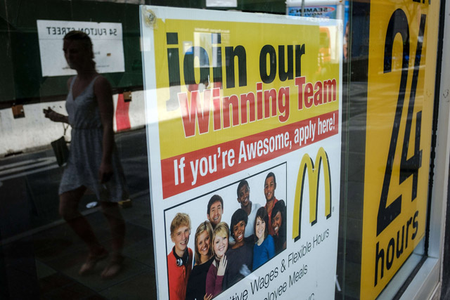 An advertisement for employment is displayed on a window of a McDonald's restaurant in Lower Manhattan in New York City on Friday (AFP photo)