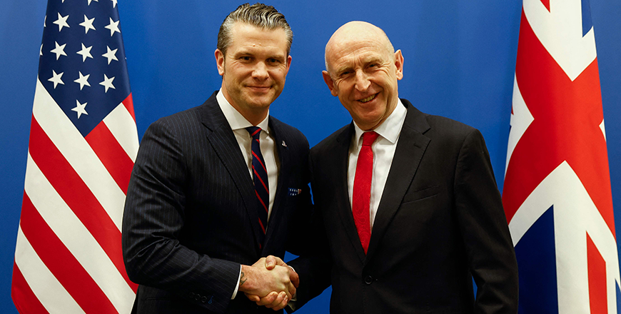 US Defense Secretary Pete Hegseth (L) shakes hands with British Defence Secretary John Healey, on the eve of a NATO defence ministers' meeting at the alliance's headquarters in Brussels, on Wednesday (AFP photo)