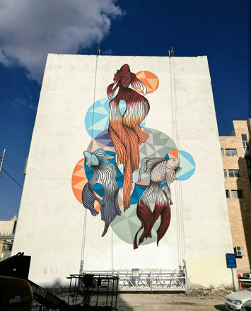   In this undated photo, one of Yazan Mesmar’s murals in Amman can be seen. The artist says this painting of three fish was intended to make children stop and think about the artwork (Photo courtesy of Yazan Mesmar)
