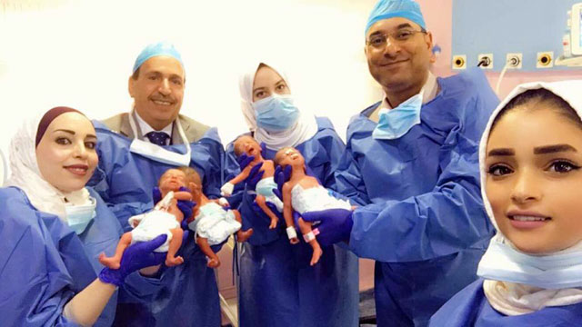 In this undated photo, doctors and nurses pose for a photo with a woman who recently gave birth to quadruplets. According to a recent Department of Statistics’ survey, Jordan’s birth rate has witnessed a ‘major’ drop (Petra photo)