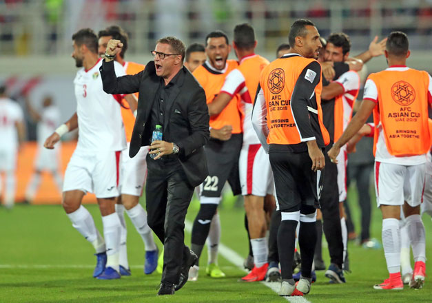 Jordan coach Vital Borkelmans celebrates their first goal against Syria at Sheikh Khalifa International Stadium, on Tuesday (Reuters photo)