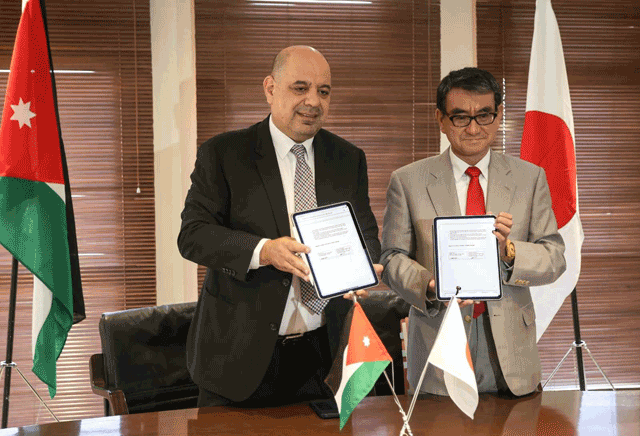 Minister of Digital Economy and Entrepreneurship Ahmad Hanandeh and Japan’s Minister for Digital Transformation Kono Taro during a signing ceremony on Tuesday (Petra photo)