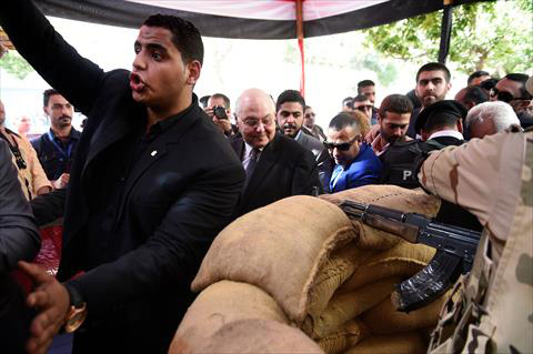 Egyptian presidential candidate Musa Mostafa Musa (centre) walks outside a polling station in the capital Cairo's central Abdin neighbourhood on Monday on the first day of voting for the 2018 presidential elections (AFP photo)