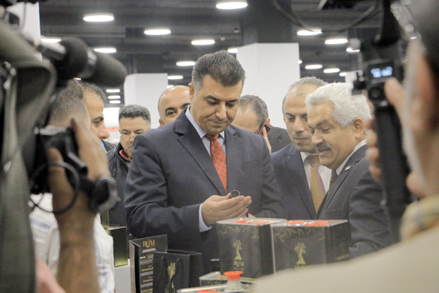 Agriculture Minister Khalid Hneifat visits a stall during the inauguration of 22nd National Olive Festival and the Rural Products Exhibition at Mecca Mall on Thursday (Photo courtesy of Mercy Corps)