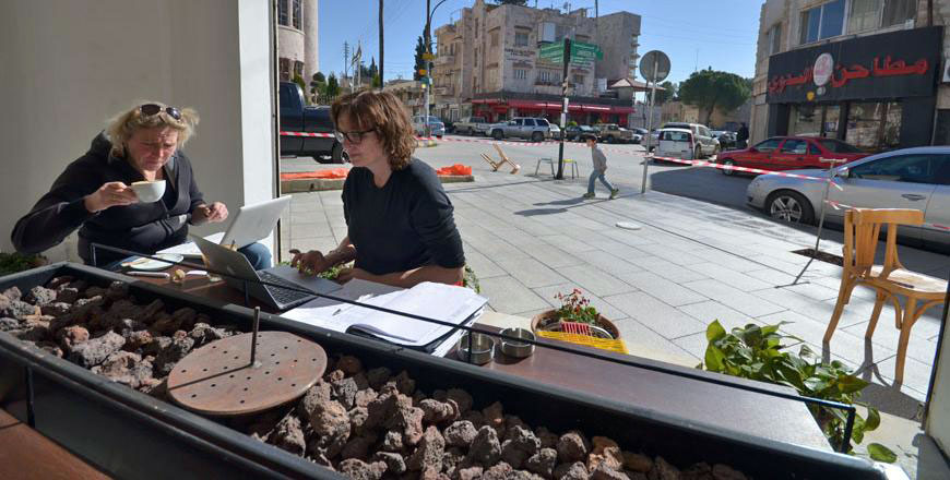 Two foreigners work on their laptops in Rumi Café in Jabal Luweibdeh in this undated photo. The Greater Amman Municipality has recently announced plans to renovate the area, while attempting to maintain its unique look (JT file photo)