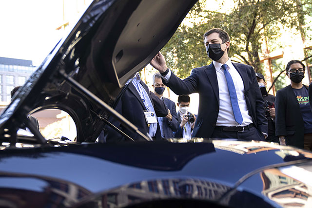 US Secretary of Transportation Pete Buttigieg looks at a Tesla Model S during an electric vehicles event outside of the Department of Transportation on Wednesday in Washington, DC (AFP photo)