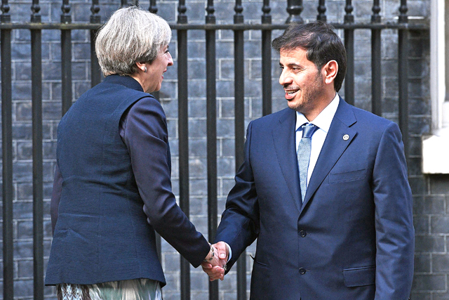 Britain's Prime Minister Theresa May greets Qatar's Prime Minister Abdullah Bin Nasser Bin Khalifa Al Thani outside of 10 Downing Street in central London on Monday (AFP photo)