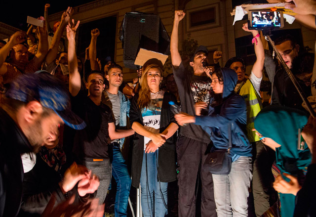Nawal Benaissa (centre) of the grassroots Al Hirak movement joins a march Wednesday in Al Hoceima demanding the release of Nasser Zefzafi, head of Al Hirak (AFP photo)