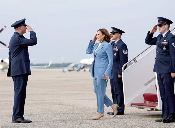 US Vice President and Democratic presidential candidate Kamala Harris salutes as she steps off Air Force Two upon arrival at Joint Base Andrews in Maryland on Friday (AFP photo)