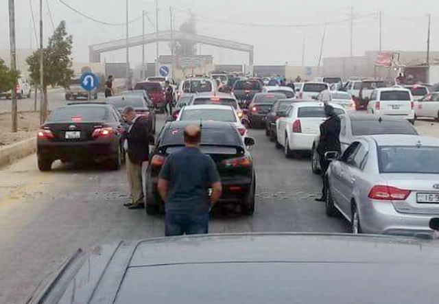 A long line of cars heading for Syria is seen on Thursday in this photo shared on social media (Photo courtesy of Facebook)