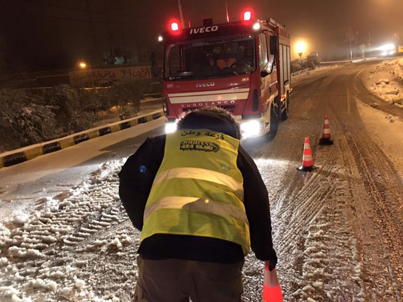 A member of the Jordan 4x4 Club works with the Civil Defence Department to assist Jordanians during a snowstorm last year  (Photo courtesy of Jordan 4x4 Club)