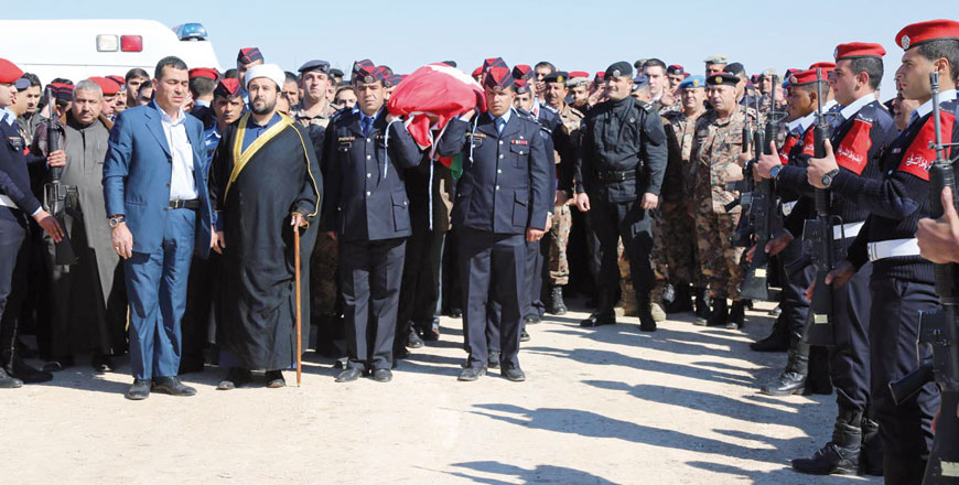 Public Security Department pilot Lt. Hazem Hassouneh is laid to rest in Sahab on Wednesday (Petra photo)