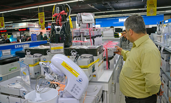 Shoppers check out discounts on home appliances at a shopping centre on the occasion of Mother's Day in Amman on Saturday (Photo by Amjad Ghsoun)