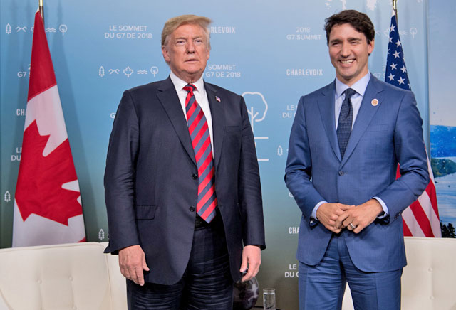 US President Donald Trump and Canadian Prime Minister Justin Trudeau hold a meeting on the sidelines of the G-7 summit in La Malbaie, Quebec, Canada, on Friday  (AFP photo)