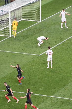 Croatia’s players  celebrate their second goal as England’s players react during the Russia 2018 World Cup semifinal football match between Croatia and England at the Luzhniki Stadium in Moscow on Wednesday  (AFP photo)