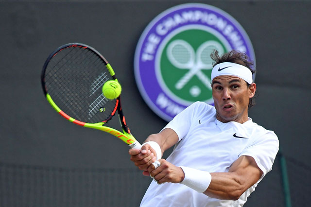 Spain’s Rafael Nadal returns against US player Sam Querrey during their men’s singles quarter-final match on day nine of the 2019 Wimbledon Championships at The All England Lawn Tennis Club in Wimbledon, southwest London, on Wednesday (AFP photo by Ben Stansall)