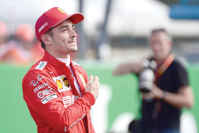 Pole position winner Ferrari’s Monegasque driver Charles Leclerc celebrates after the qualifying session at the Autodromo Nazionale circuit in Monza on Saturday ahead of the Italian Formula One Grand Prix. (AFP photo by Miguel Medina)