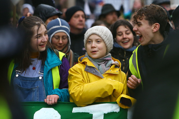 Swedish climate activist Greta Thunberg (centre) takes part in a ‘Youth Strike 4 Climate’ protest march in Bristol, south west England, on Friday (AFP photo)